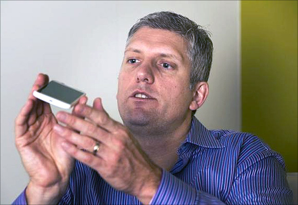 ick Osterloh, senior vice president of product management for Motorola Mobility, describes the size of Motorola's new Moto X phone.