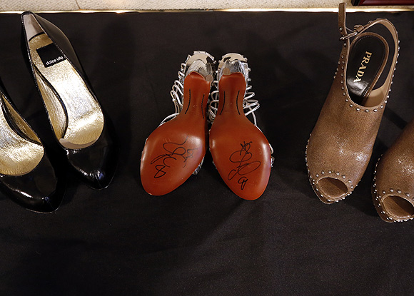 Pairs of Carrie Bradshaw's shoes are displayed at Gotta Have it! auction house in New York auction house in New York.