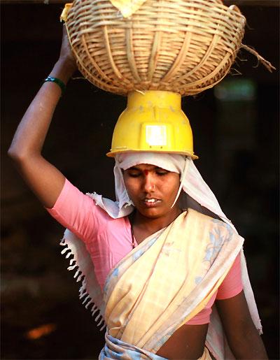 A labourer works in a steel factory near Jammu.