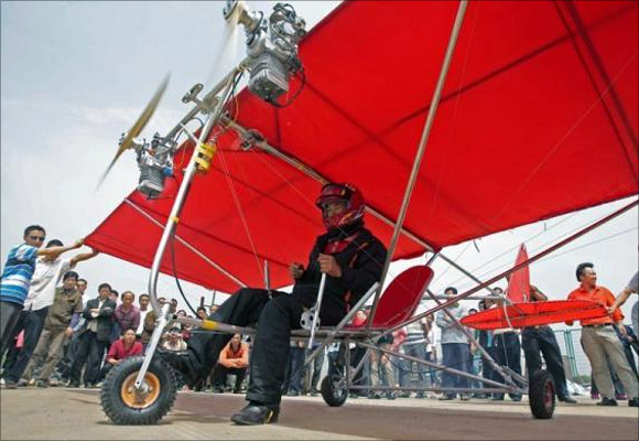 Farmer Shu Mansheng prepares to take off with his homemade ultralight aircraft in Wuhan, Hubei province, China.