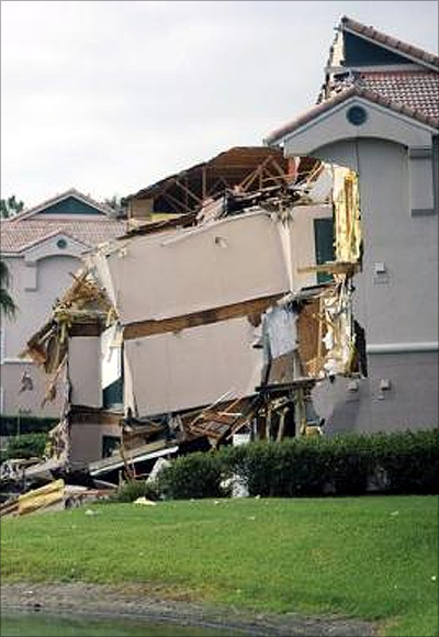  section of the Summer Bay Resort lies collapsed after a large sinkhole opened on the property's grounds in Clermont, Florida.