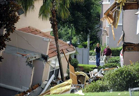  section of the Summer Bay Resort lies collapsed after a large sinkhole opened on the property's grounds in Clermont, Florida.