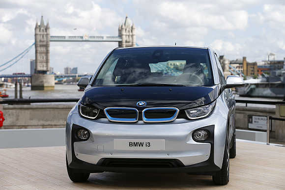 BMW i3 electric car with Tower Bridge behind it in London.