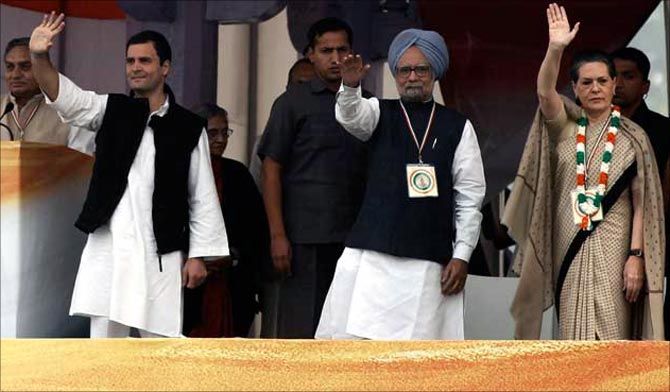 Dr Manmohan Singh, flanked by Rahul Gandhi and Sonia Gandhi
