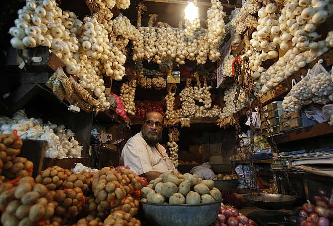 A vendor waits for customers at his stall at a wholesale food market in Mumbai.