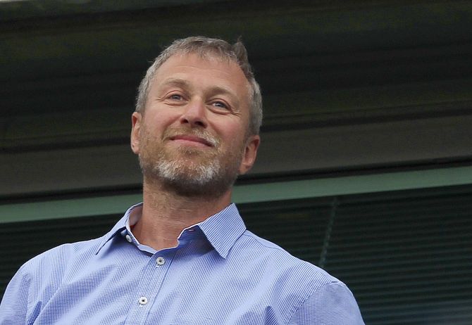 Chelsea owner Roman Abramovich watches the players do a lap of honour after their English Premier League soccer match against Blackburn Rovers at Stamford Bridge in London.