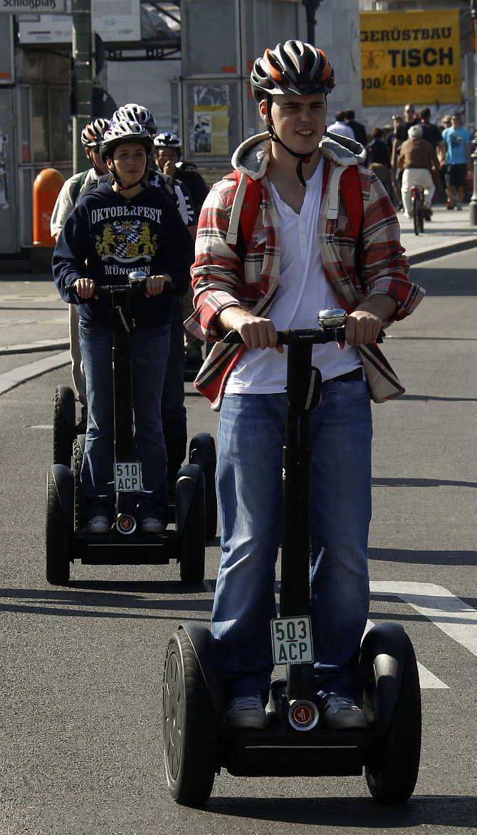 Tourists take part in a guided tour through the city on segways in Berlin, Germany.