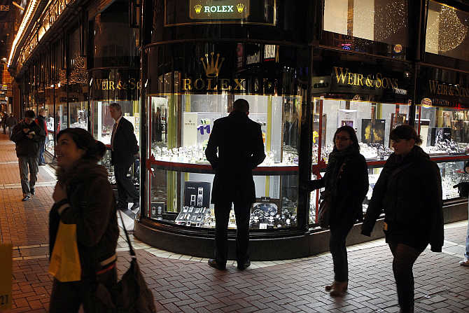 A man looks at a window display of jewellery on Grafton Street, Dublin, Ireland.