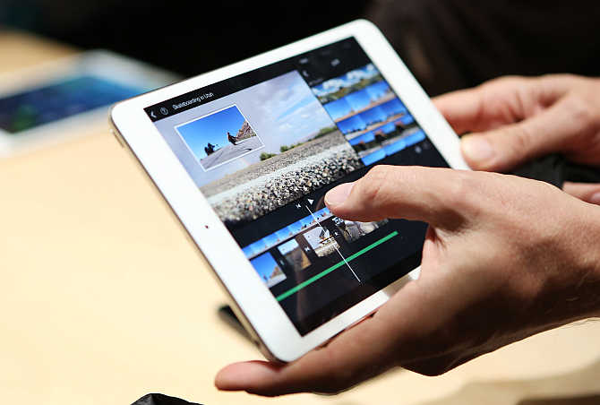 A man holds an iPad Mini 2 with Retnia display in San Francisco, California.