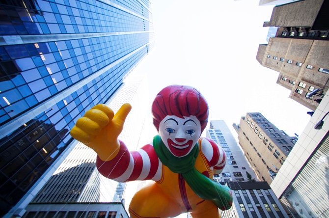 A Ronald McDonald balloon floats down Sixth Avenue during the 87th Macy's Thanksgiving Day Parade in New York, November 28, 2013.