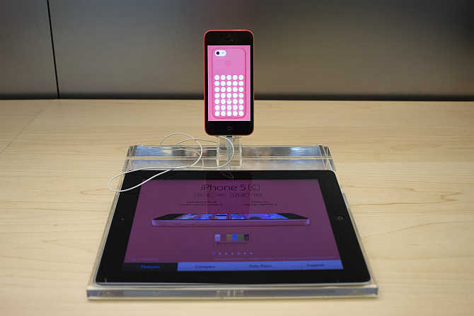An iPhone 5c is on display at the Apple Retail Store on Fifth Avenue in Manhattan, New York.