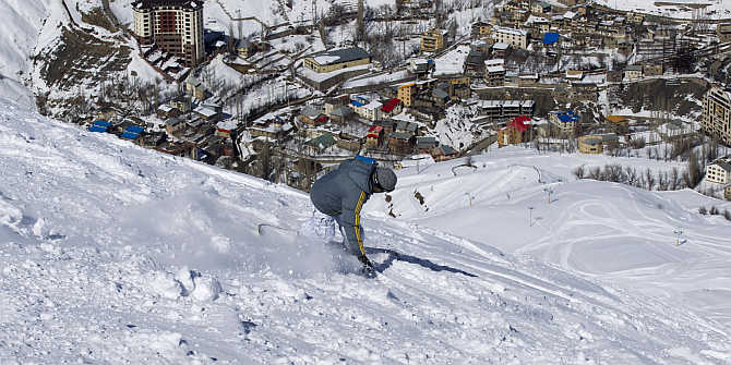 A snowboarder navigates the slope at the ski resort in Shemshak, 50km northeast of Tehran, Iran.
