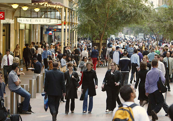 Lunchtime crowds flood into the Pitt Street Mall in Sydney's city centre, Australia.