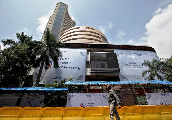 A man walks past the Bombay Stock Exchange building.