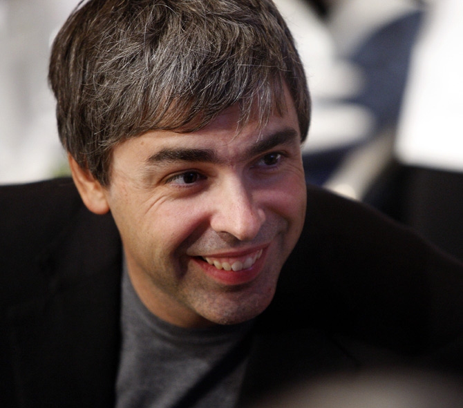 Google co-founder Larry Page speaks with people at his lunch table during the Clinton Global Initiative in New York.