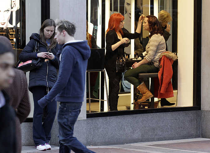 A woman has her make up applied in the Brown Thomas department store on Grafton Street in central Dublin, Ireland.
