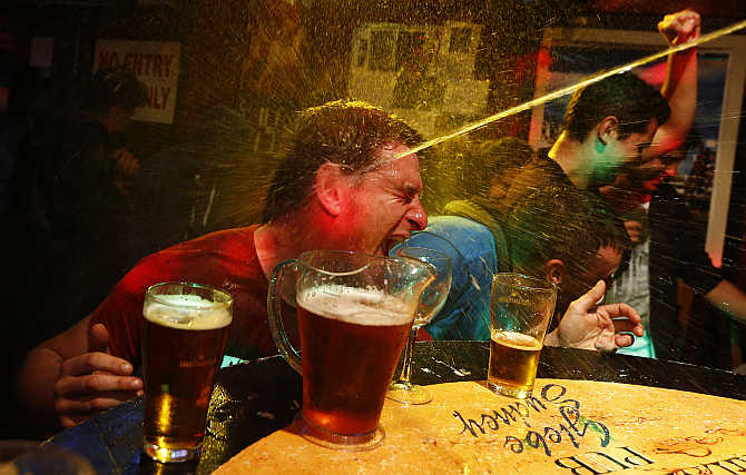 A party goer is splashed with water at a pub in central Sydney.