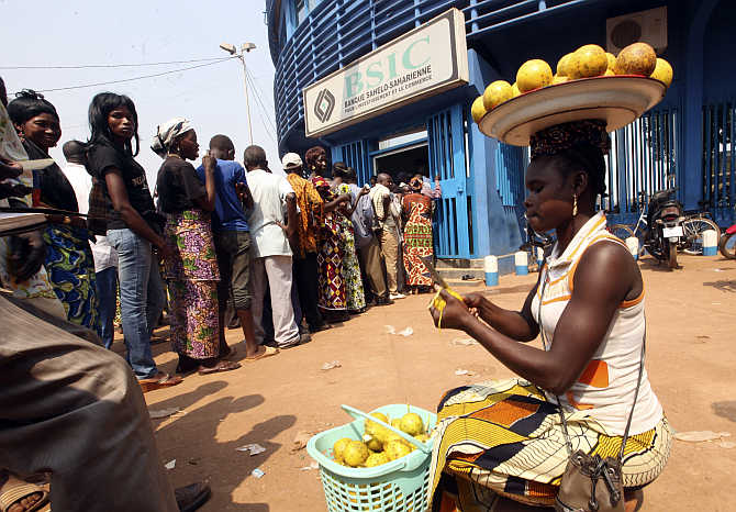 People wait in line at the BSIC bank in Bangui, Central African Republic.