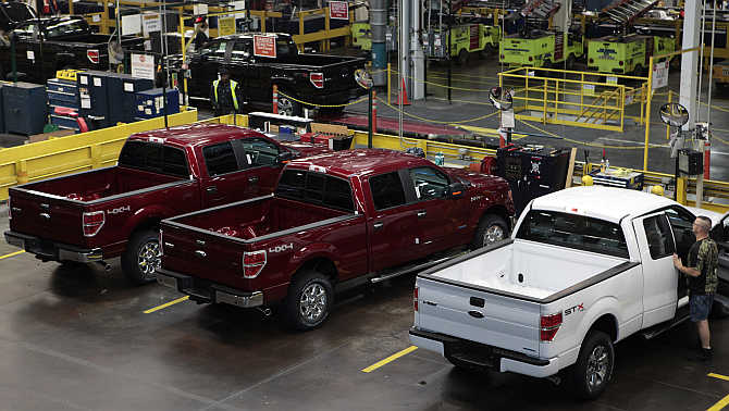 2014 Ford F-150 pick-up trucks are seen in quality control at the Ford Motor Dearborn Truck Plant in Dearborn, Michigan.