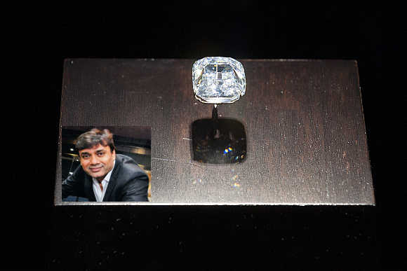 Arch Duke Joseph diamond sits on display at Christie's auction house in New York. Mavji Bhai Patel, inset.