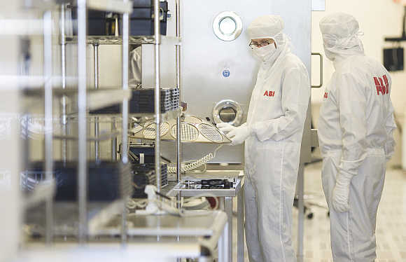Employees work on the production of high-power semiconductors at a manufacturing plant of Swiss engineering group ABB in Lenzburg. Photo is for representation purpose only.