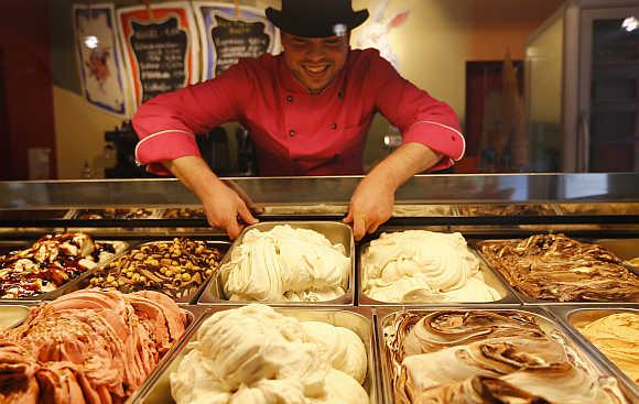 Ice-cream maker Matthias Muenz arranges white sausage and beer flavoured ice-cream in his shop 'The crazy icecream maker' in Munich, Germany/