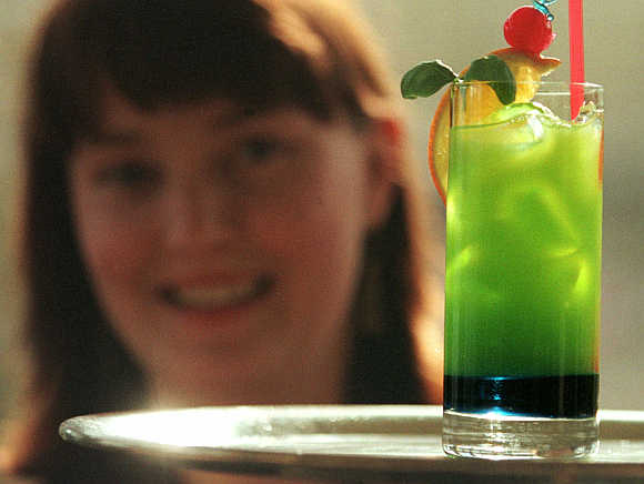 A barmaid serves a cocktail in Helsinki, Finland.