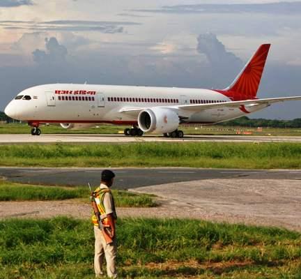 A security personnel stands guard as Air India's Dreamliner Boeing 787 taxies upon its arrival at the airport in New Delhi.