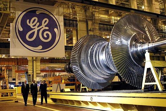 US President Barack Obama (C) passes a turbine as he tours General Electric's birthplace in Schenectady, New York.