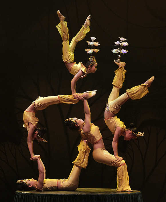 Acrobats perform during a rehearsal of China's Kunming acrobatic troupe in Bogota, Colombia.