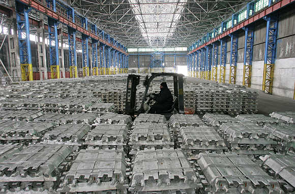 An employee inside the Tajikistan Aluminium's smelter complex, 50km west from the Tajik capital of Dushanbe.