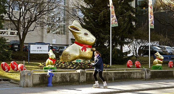 Giant gold-wrapped Easter bunnies are placed in front of the plant of Switzerland's chocolate producer Lindt & Spruengli in Kilchberg near Zurich.