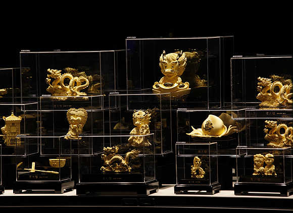 Figurines in 24K gold are displayed at a Chow Tai Fook jewellery store in Hong Kong.