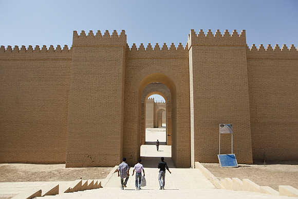 Visitors enter the ancient city of Babylon near Hilla, 100km south of Baghdad.