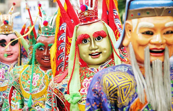 Chinese 'soldiers of god' participate in a ritual procession in Phuket.