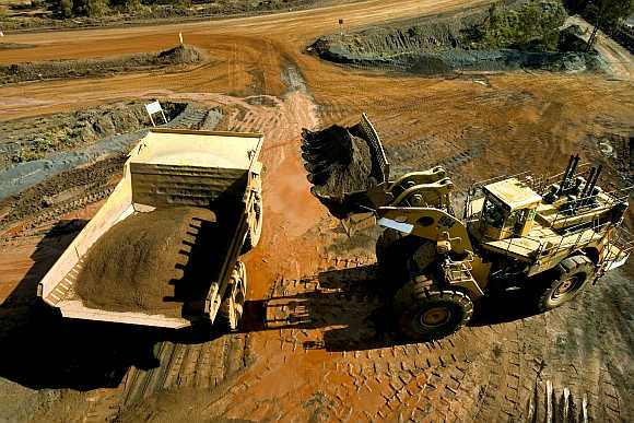 A haul truck is loaded with iron ore at a BHP Biliton mine in West Australia's Pilbara region.