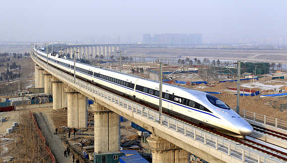 A high-speed train travelling to Guangzhou runs on Yongdinghe Bridge in Beijing.