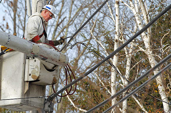 A National Grid electric worker repairs power lines in Worcester, Massachusetts, United States.