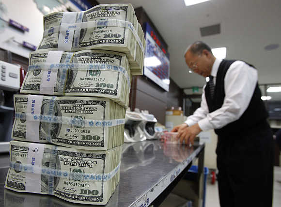 Stacks of dollar notes at a bank in Seoul, South Korea.