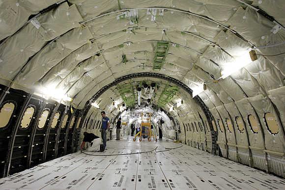 Boeing employees work on interior assembly of 787 Dreamliner at the company's plant in Everett, Washington.