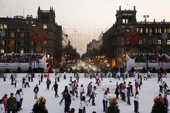 Ice skaters are seen on a skating rink in Mexico City's historic Zocalo square.