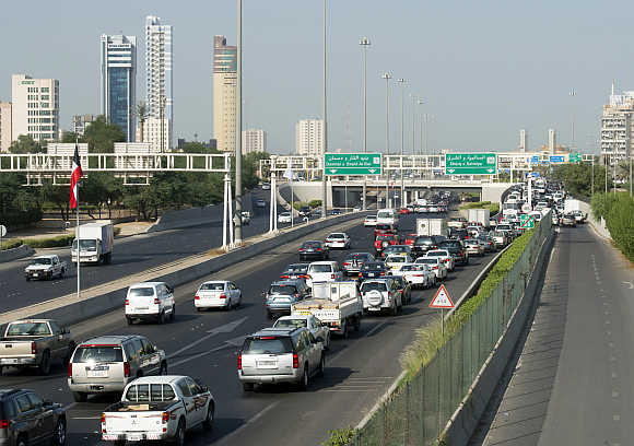 Vehicles travel on the First Ring Road in Kuwait City.