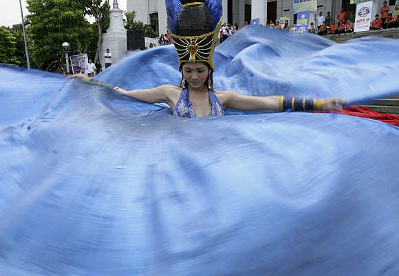A dancer performs during the Kalesa Festival in Manila.