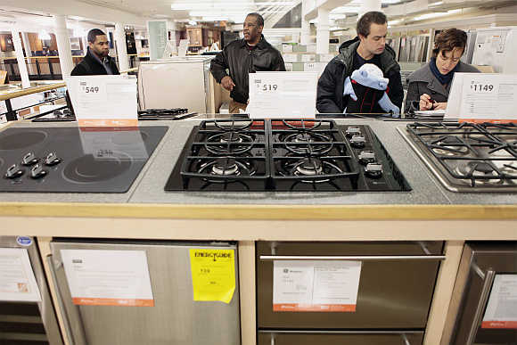 Shoppers look at durable goods appliances at a Home Depot store in New York, United States.