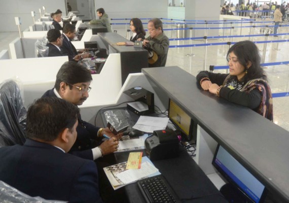 Passengers queue up for their boarding passes at the new Kolkata airport.