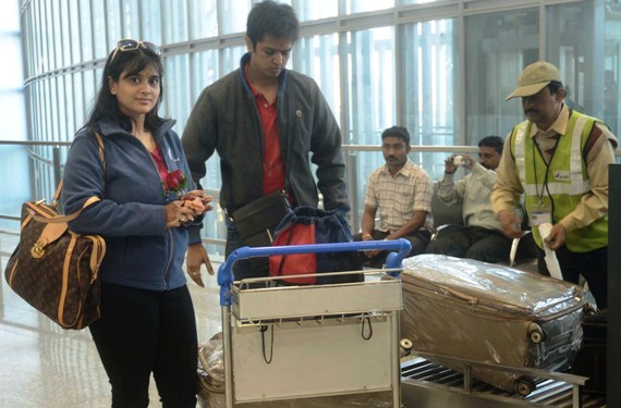 Passengers get their luggages X-rayed at the new Kolkata airport.