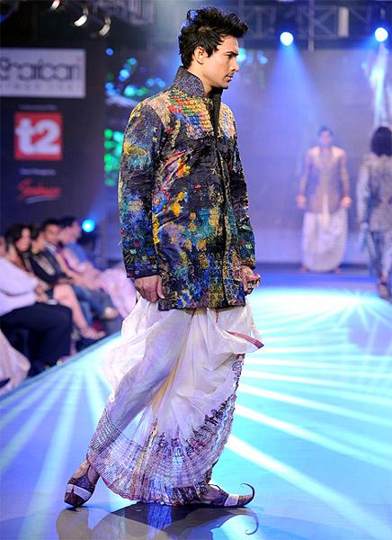 A model clad in dhoti kurta designed by Sharbari Datta.