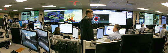 US Department of Homeland Security analysts work at the National Cybersecurity & Communications Integration Center located just outside Washington in Arlington, Virginia.