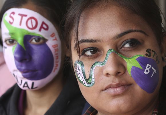 Students from the department of environment studies pose with their painted faces during a protest against bacillus thuringniensis Bt brinjal.