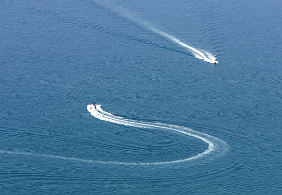 Pleasure crafts leave patterns in the sea in the resort town of Acapulco, Mexico.